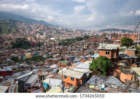 Medellín slums, Colombian slum, Medellin cartel, Beautiful view on the communa 13 Neighborhood, outstanding house, cityscape in colombia Royalty-Free Stock Photo #1734265010