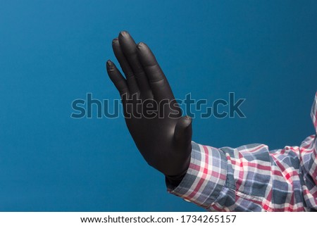 Hygienic hand protection, fine black glove to avoid losing touch in the hands. Hand and finger signs.