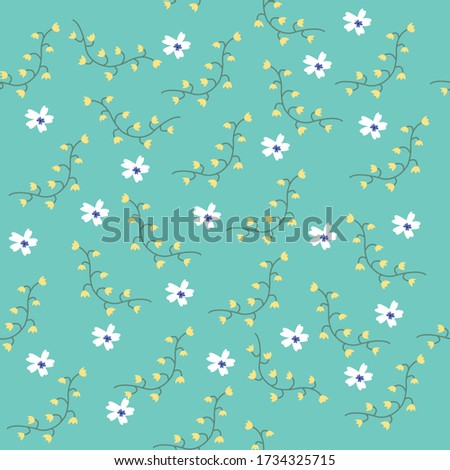 Trendy tiny yellow and white wildflower seamless pattern on blue background for fashion print. 