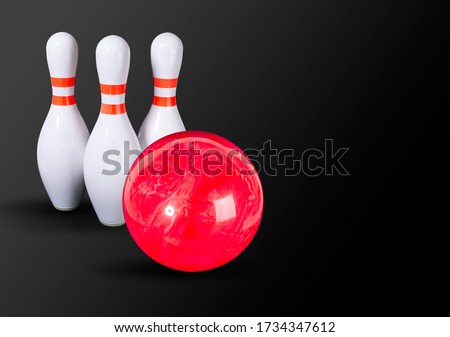 Bowling. Bowling ball and bowling pins on a beautiful black gray background. Place for your inscription. Copy space