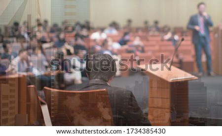 Meeting concept. Conference blur with business people training and learning. Coaching concept with blurred background. Speaker talking to audience in hall during seminar event. Lecture series speech.
