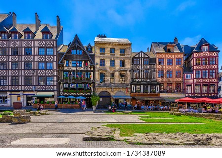 Street with timber framing houses in Rouen, Normandy, France. Architecture and landmarks of Rouen. Cozy cityscape of Rouen Royalty-Free Stock Photo #1734387089