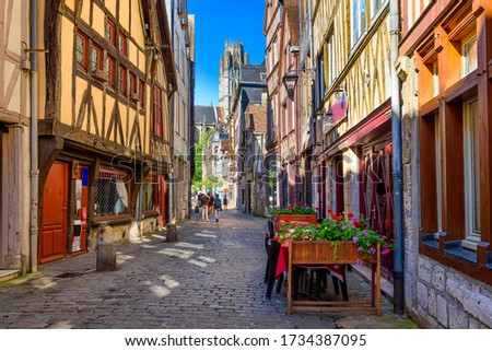 Street with timber framing houses in Rouen, Normandy, France. Architecture and landmarks of Rouen. Cozy cityscape of Rouen Royalty-Free Stock Photo #1734387095