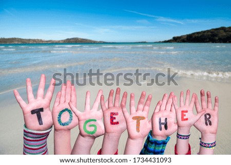 Children Hands Building Word Together, Ocean Background