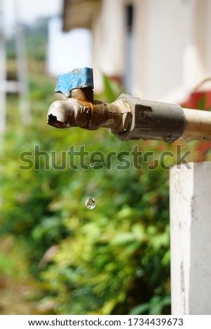 Broken water tap dripping water