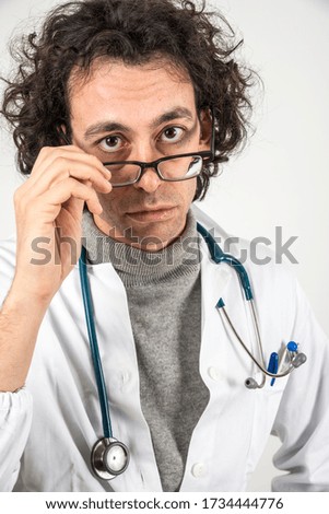portrait of a doctor with glasses and stethoscope