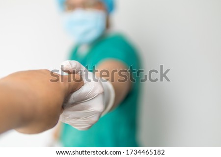Friendly male medicine doctor hands holding patient hand for encouragement, empathy, cheering and support while medical examination. New life of abortion, health care, hospital, covid-19 concept Royalty-Free Stock Photo #1734465182