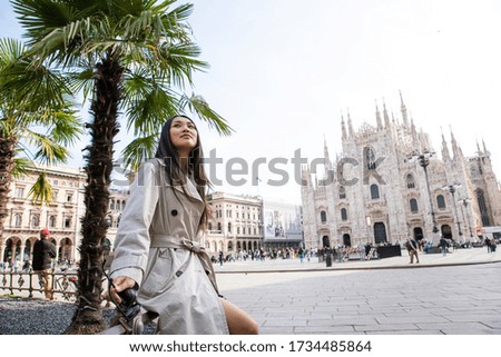 Happy traveler chinese girl in Milan city