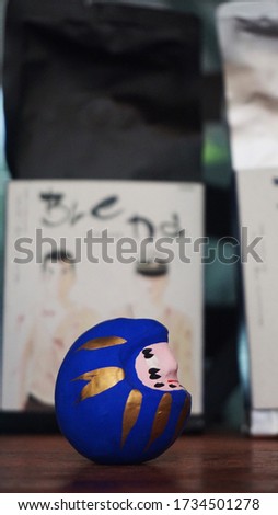                 closeup of blue daruma doll, japanese traditional culture               