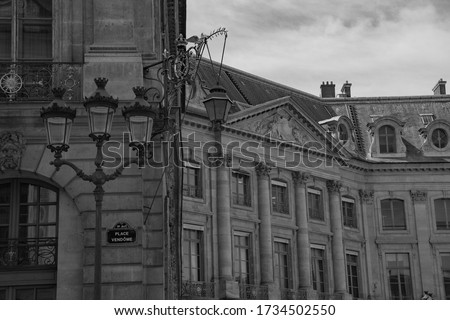 Place Vendome sign, View of Paris in sunlight, Parisian houses roofs typical facades architecture