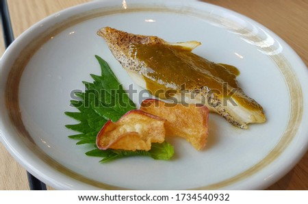 Halibut fish grilled topped with lemon sauce