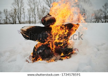 Celebration of Shrovetide - traditional russian holiday, burning of a scarecrow.