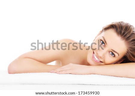 A picture of a young woman resting her head on a towel over white background Royalty-Free Stock Photo #173459930