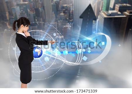 Businesswoman pointing against road turning into arrow