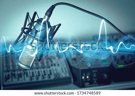 Microphone and digital studio mixer on background