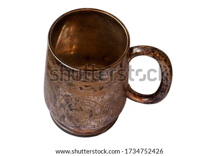 Old silver mug isolated. Shaded silver. Texture of silver sulfate on the surface of the cup.