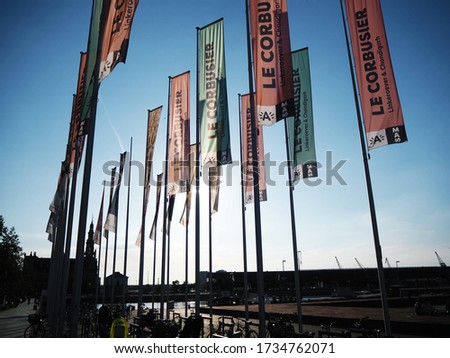 Flags in Antwerp Belgium (MAS museum)  against the afternoon sun last summer. Royalty-Free Stock Photo #1734762071