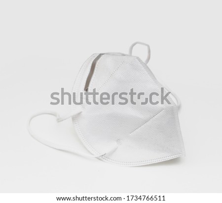 FPP2 Face Mask isolated over white background. Surgical white face mask.  Royalty-Free Stock Photo #1734766511