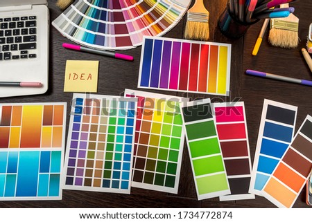 Laptop and color palette brush and gloves for your design home at office. Tools for renovation 