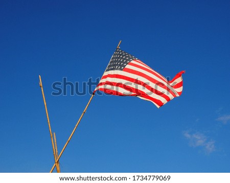 US flag in the blue sky.