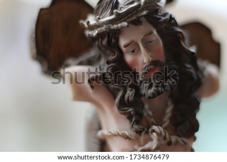 the crucifixion of Jesus as a symbol of love (antique portrait statue)