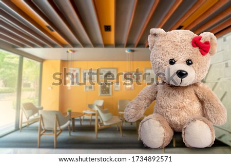 The bear is separated from the house background.