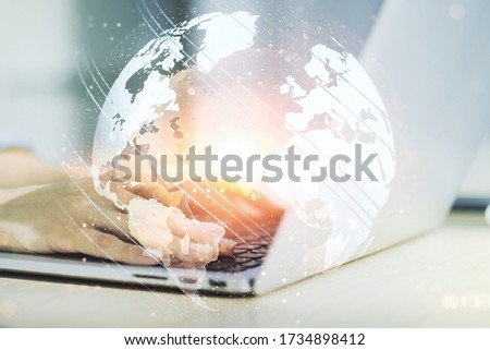 Multi exposure of abstract creative digital world map and hands typing on computer keyboard on background, tourism and traveling concept Royalty-Free Stock Photo #1734898412