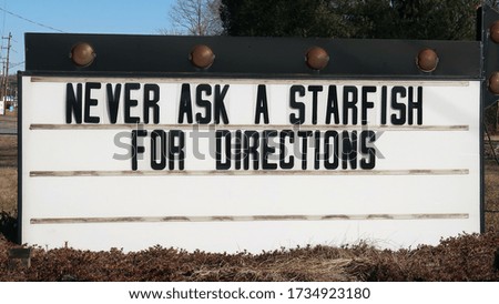 Humorous sign that says, NEVER ASK A STARFISH FOR DIRECTIONS.