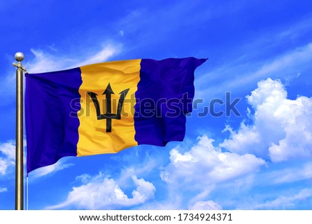 Barbados National Flag Waving In The Wind On A Beautiful Summer Blue Sky Royalty-Free Stock Photo #1734924371