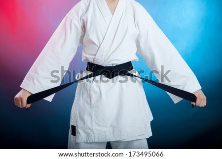 karate girl with black belt posing