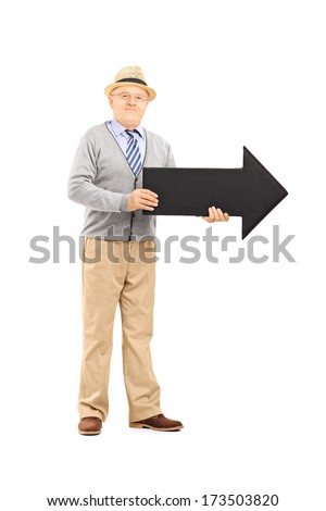 Full length portrait of senior gentleman holding big black arrow pointing right isolated against white background
