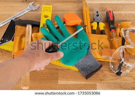 Picture of construction equipment and tools on wooden background, top view