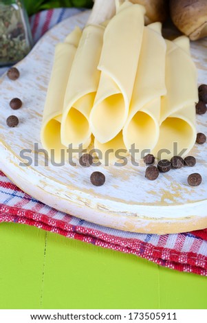 Cream cheese with vegetables and greens on wooden table close-up