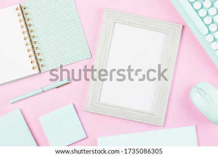 flat lay stationery on work desk in pink pastel background	