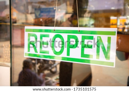 Reopen Signage board in front of Businesses or store door after covid-19 or coronavirus crisis- Concept of back to business after lockdown.