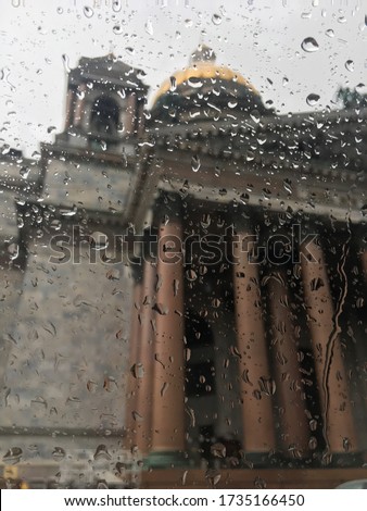 A church in St. Petersburg viewed through a rainy pane