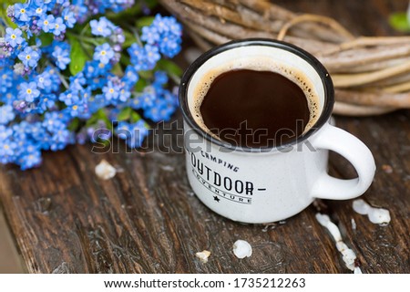 
Blue forget-me-not flowers and a cup of hot coffee with the inscription
rest at nature. Close-up. Copy space for text. The concept of holidays and good morning wishes.