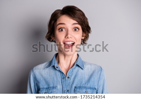 Closeup photo of attractive shocked lady wavy bobbed hairdo open mouth listen amazing good news cheerful person wear casual denim shirt isolated grey color background