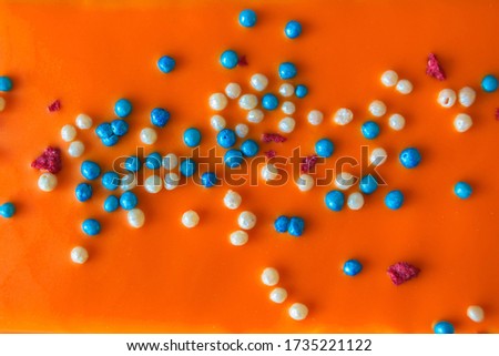 Orange cake with red, white and blue sprinkles. Festive Dutch cake. The traditional colors of the Dutch royal family and state flag.