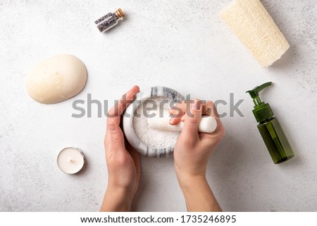 Spa background in flat style on natural stone background. Spa treatment. Health care. Top view, flat lay. Wellness and self-care concept.