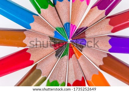 Set of colored pencils for drawing close-up photos on a white background