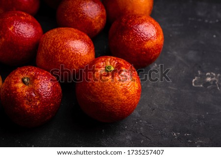 Ripe bloody oranges on the rustic background. Selective focus. Shallow depth of field.