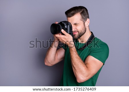 Profile side photo of concentrated paparazzi man have summer free time weekend shooting picture use professional camera wear good look clothes copyspace isolated over gray color background