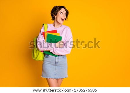 Photo of crazy astonished high school girl hold materials books have bag look copyspace impressed she see her classmate scream wow omg wear jumper denim isolated bright color background