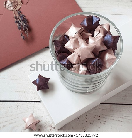 Decor from stars in a glass vase on the table