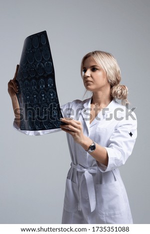 Young doctor poses for a magazine in the studio