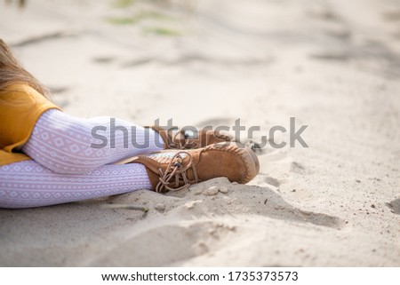 girl on the beach. young girl lying on the beach. 