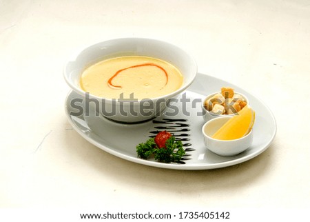 Soup made with lentil water. Served with butter and lemon