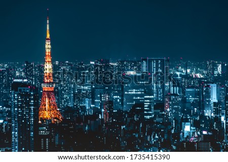 Tokyo city skyline view and office business building skyscraper downtown center with Tokyo Tower at evening in Japan. Asia tourism, modern city life, or business finance and economy concept