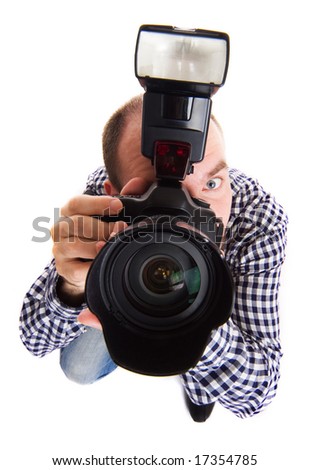 Professional photographer making the shoot. Isolated on white